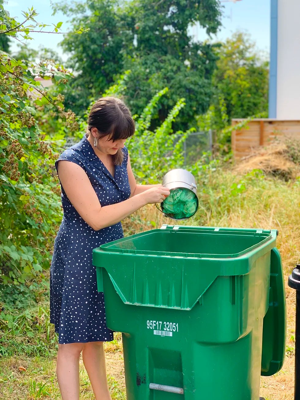 Lady throwing compost items in the compost bin